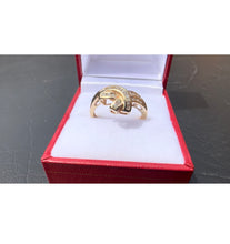 Load image into Gallery viewer, #481 - 10kt Yellow Gold, Diamond Baguette Twist Band, Size 8 1/2
